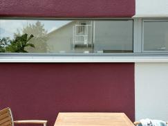 PaX Fensterverglasung im Farbübergang der Hausfassade